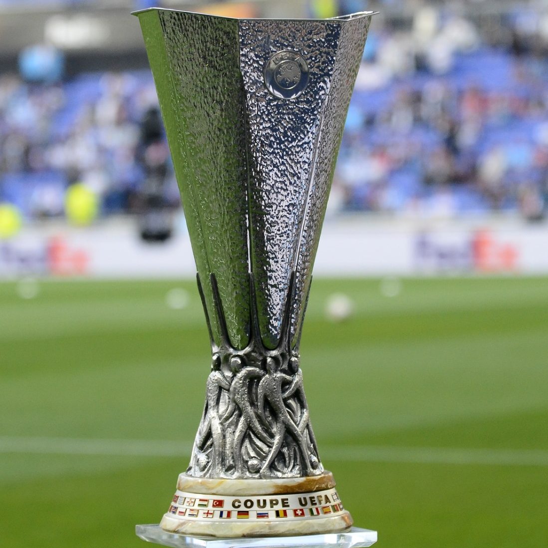 A picture of the UEFA Europa League trophy, which is silver and vase-shaped.