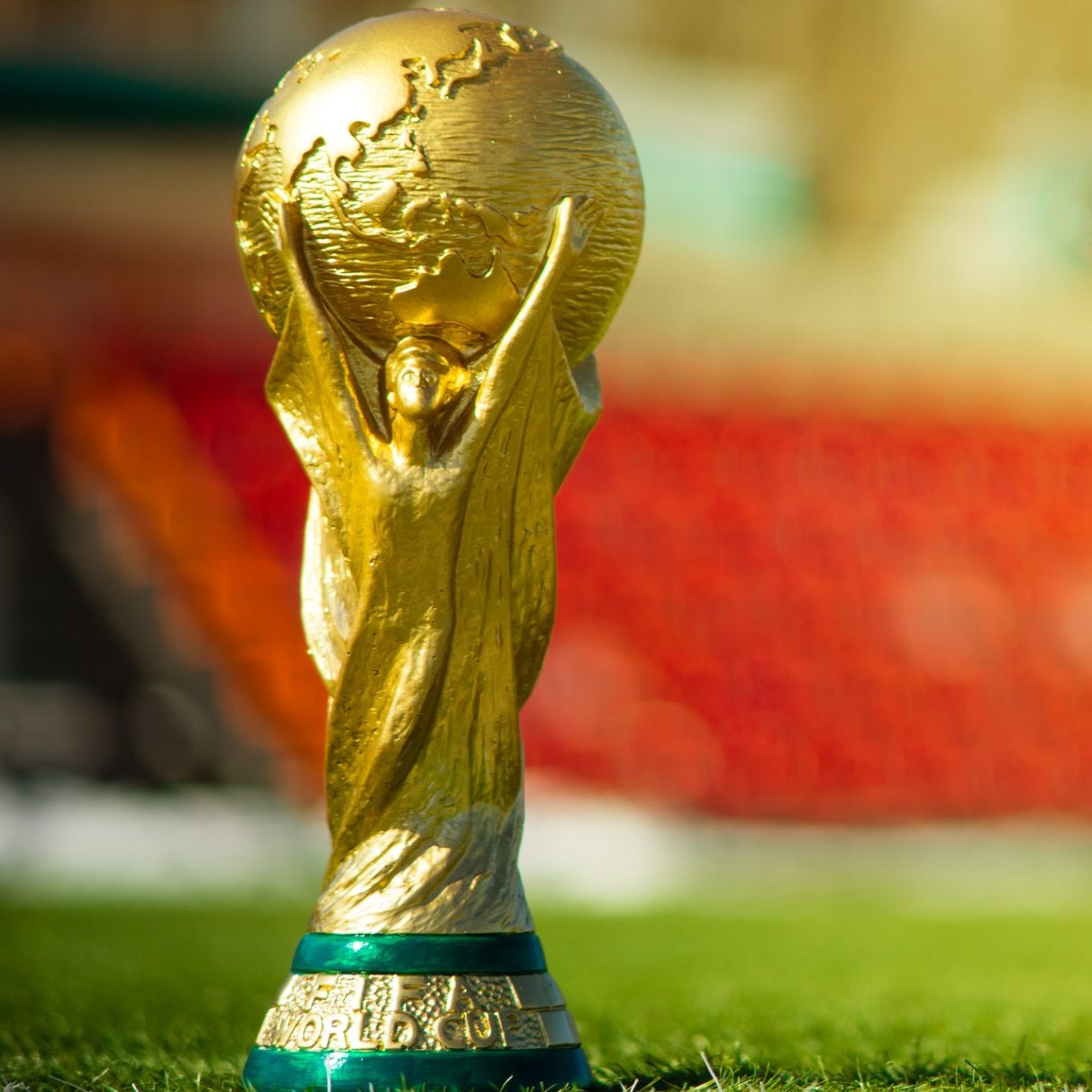 The World Cup trophy, which is gold and features a globe being held aloft.